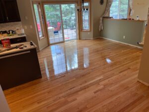 Newly installed hardwood floors shining with a perfect finish