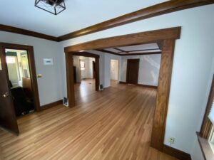 Stunning hardwood floors stretching into multiple rooms in a house